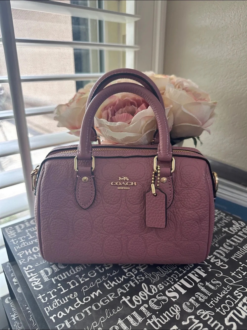 Coach mini Rowan signature leather in the color peony